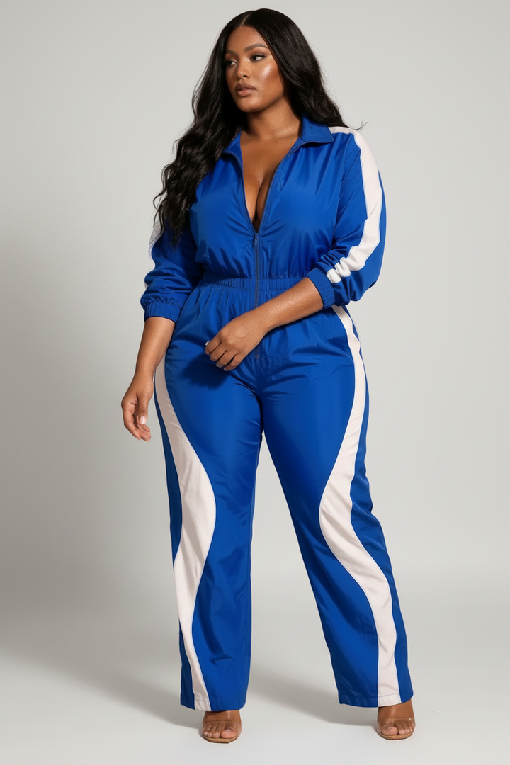 The Fast Lane Set — cobalt blue and white contrast two-piece with zip-up crop track jacket and high-waist track pants