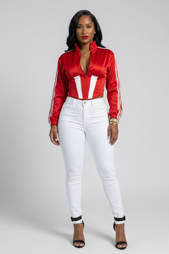 The MVP Set — red satin side-stripe zip-up cropped jacket with matching detachable lace-up corset for a sporty two-piece statement look