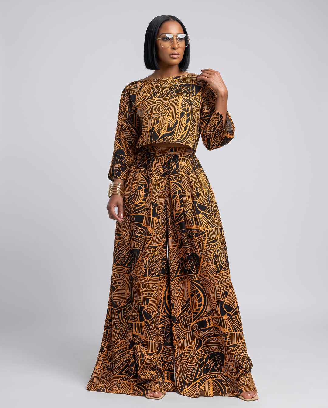 The Willow Set — black and gold abstract print two-piece with loose-fit cropped top and high-waist wide leg pants with pockets
