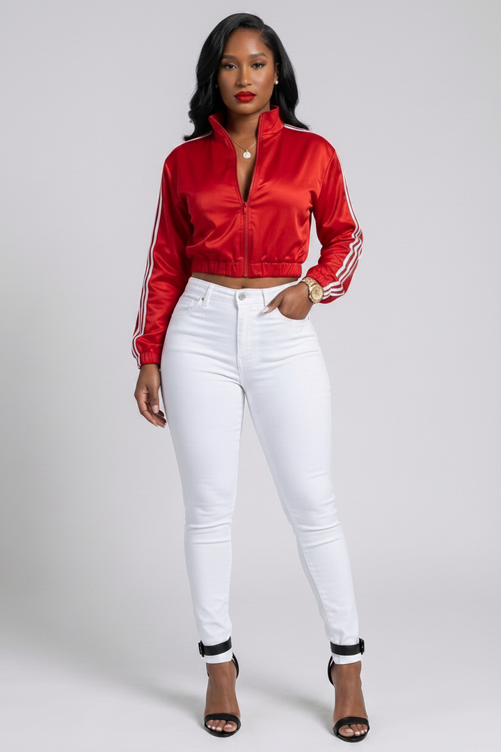 The MVP Set — red satin side-stripe zip-up cropped jacket with matching detachable lace-up corset for a sporty two-piece statement look